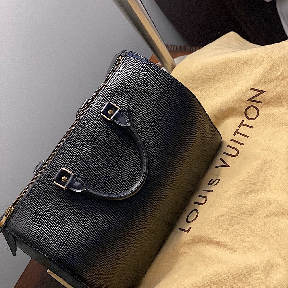 Authentic Black- Louis Vuitton Purse not used was a gift.